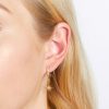 Gold Moon & Star Huggie Hoops - Image 3